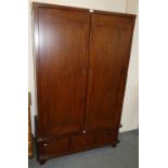 A Willis and Gambier mahogany two door wardrobe with three drawers beneath, 120 x 60 x 195 cm