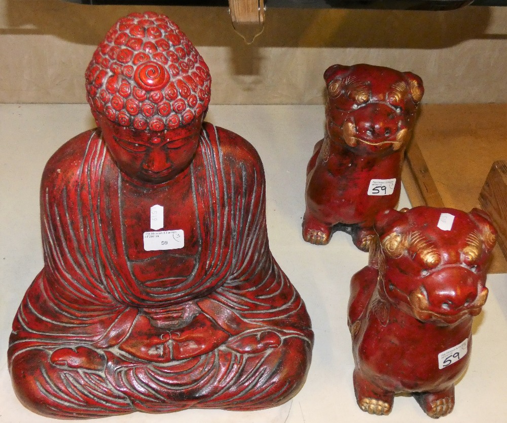 A pair of Chinese composite dogs together with a seated Buddha, 40 cm tall (3)