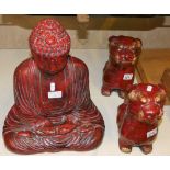 A pair of Chinese composite dogs together with a seated Buddha, 40 cm tall (3)