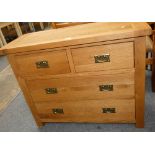 A modern oak two plus two chest of drawers, 77 cm tall x 97 cm long x 42 cm deep