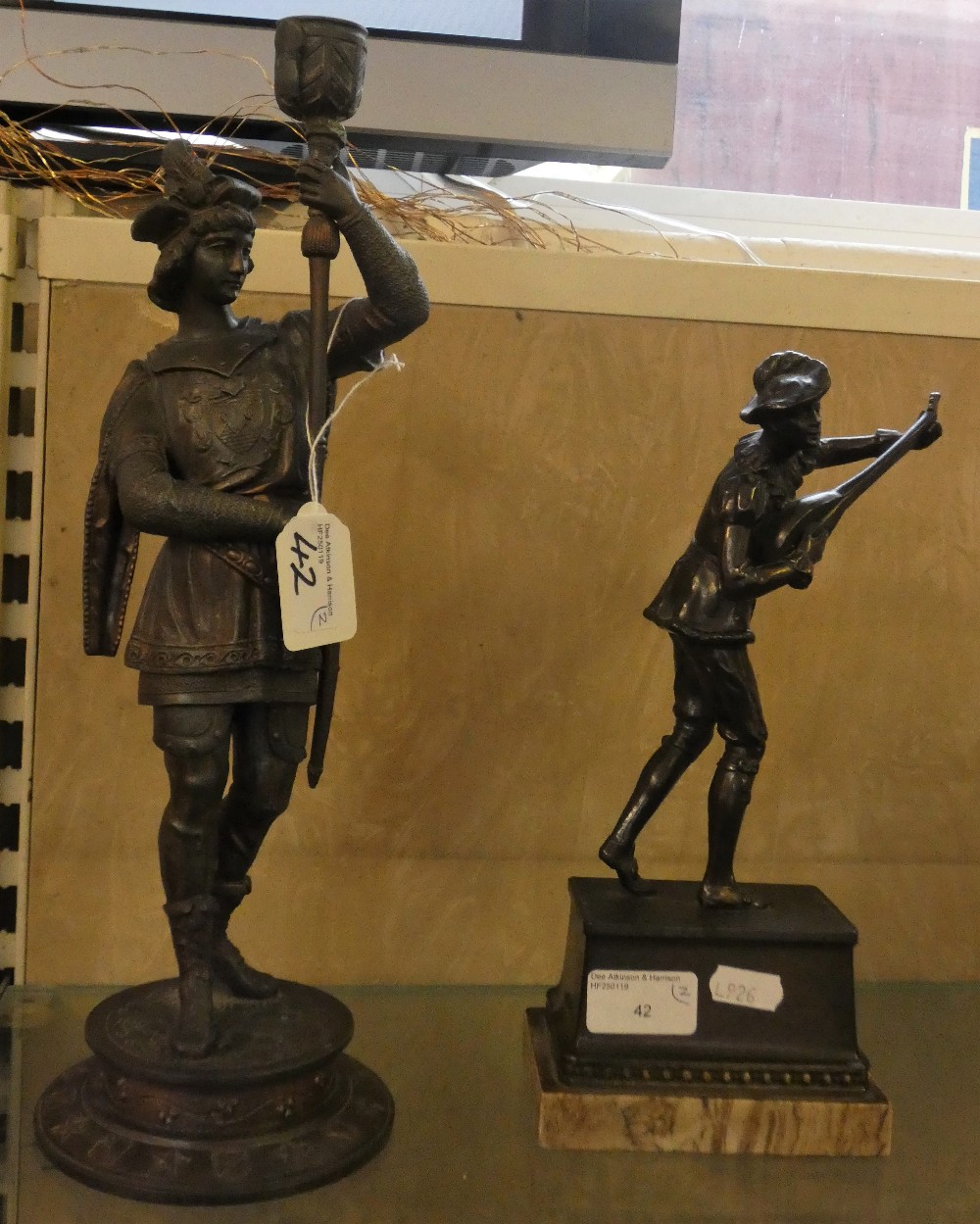 A bronzed spelter figure of a mandolin player together with a spelter figure (2)