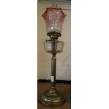 A brass column oil lamp, glass bowl and shade, 72 cm tall