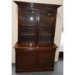 A Victorian bookcase on cabinet, 126 cm long x 39 cm deep x 202 cm high