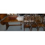 An oak drop leaf dining table together with a matching set of six dining chairs (7)