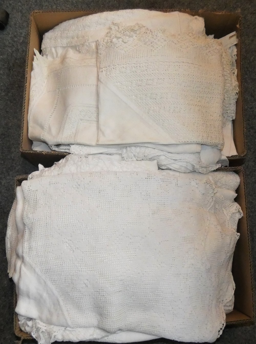 A large quantity of vintage linen in two boxes