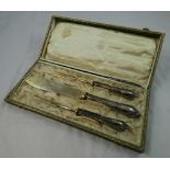 A German 800 standard silver Art Nouveau three piece serving set, bearing control marks, the handles