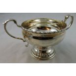 Garrards - a silver porringer, London 1961, of pedestal form with a gadrooned border and leaf capped