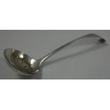 A Victorian silver sugar Old English pattern sifter spoon, Sheffield 1889, initialled.