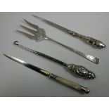 An Edwardian silver and mother of pearl letter opener, Sheffield 1904, another Sheffield 1889, a