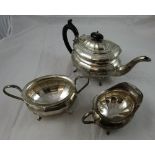 A silver three piece tea service, by Viners, Sheffield 1932, of oval panelled form, raised on four