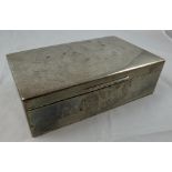 A large silver cigarette or cigar box, London 1924, the engine turned lid to plain sides, opening to