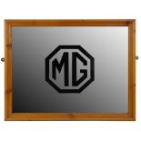 *An MG mirror, later pine frame, 45 x 55 cm. Purchased from the Abingdon Road closure auction in the