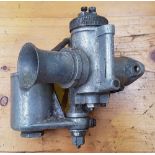 An Amal GP carb and float chamber, stamped 10 TT 37 RN, 3/32, 14J.