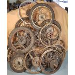 A large quantity of mainly post war motorcycle wheels, some with hubs.