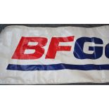 *A BF Goodrich Tires banner, 70 x 295 cm.