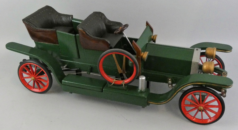 A scratch built wooden and metal model of a Rolls Royce Silver Ghost, painted green, length 84 cm.