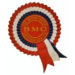 A fibreglass advertising sign for The British Motor Corporation Limited in the form of a rosette,