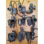 A pair of Amal carbs, an Amal 289/116R carb and six other Amal carb, (9).