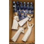 Four Lladro figurines together with five Delft figural pieces