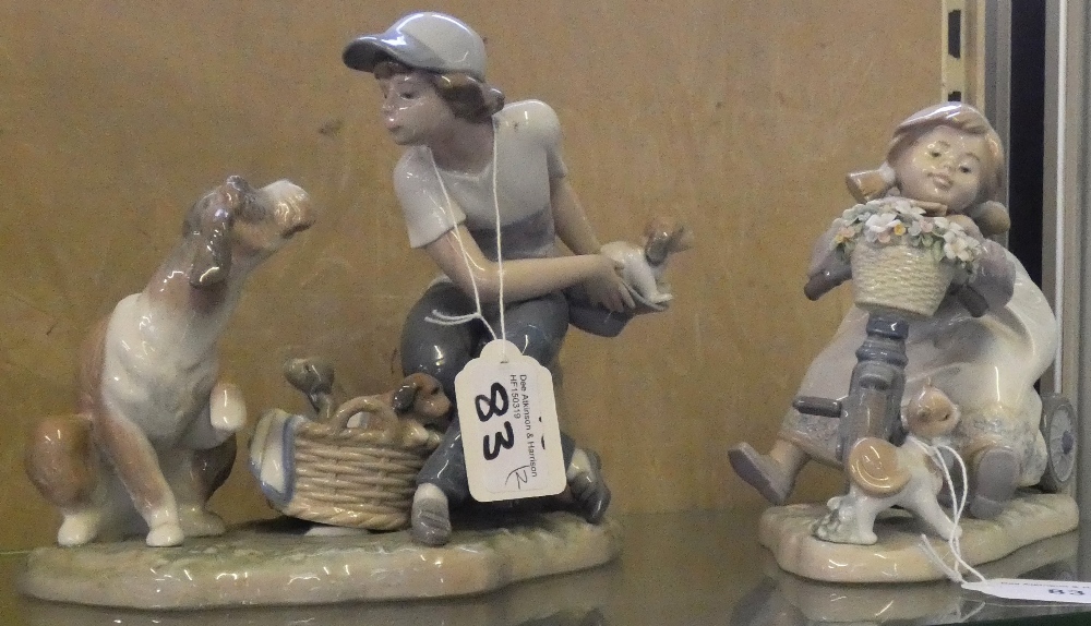 Lladro figures of girl with dog and puppies and a girl on a tricycle with cat (2)