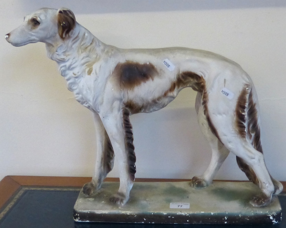 A painted plaster model of a standing dog on plinth, 48 cm long x 40 cm tall