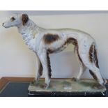 A painted plaster model of a standing dog on plinth, 48 cm long x 40 cm tall