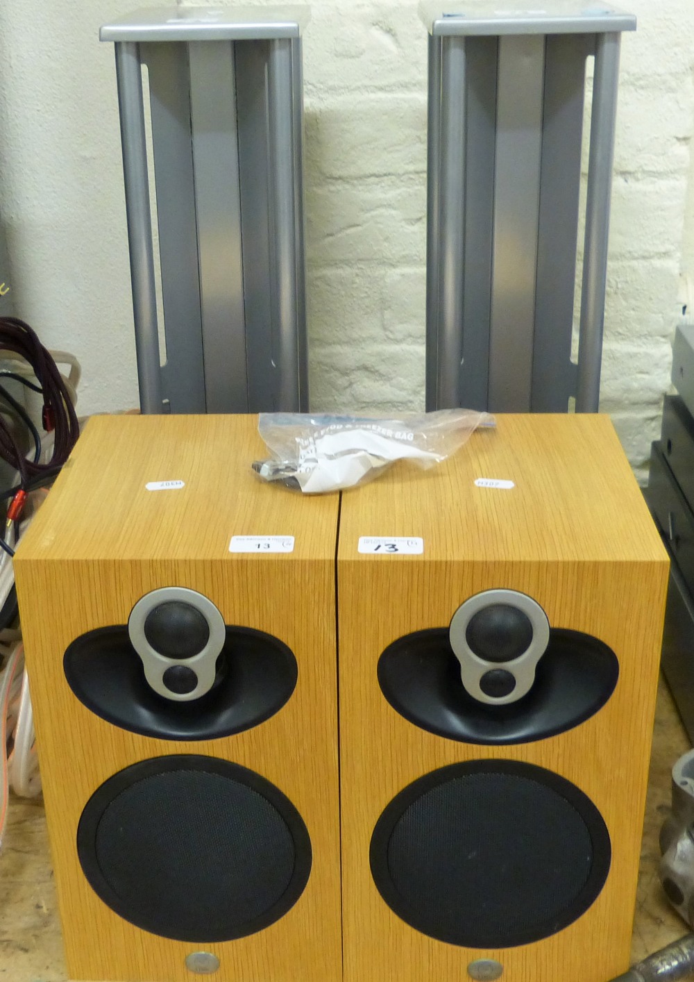 A pair of Linn speakers (1 AF) in oak, serial numbers 1245709 and 1245710 with stands