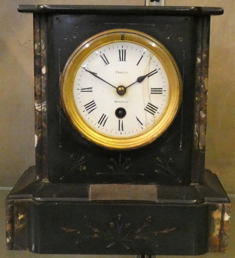 A slate and marble mantle clock, the face marked 'Pexton of Beverley', with presentation plaque from