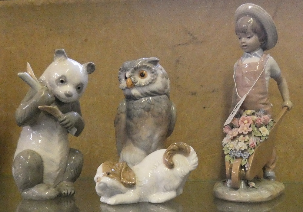 Lladro figure of child with wheelbarrow and three figures by Nao, owl, panda and dog (4)