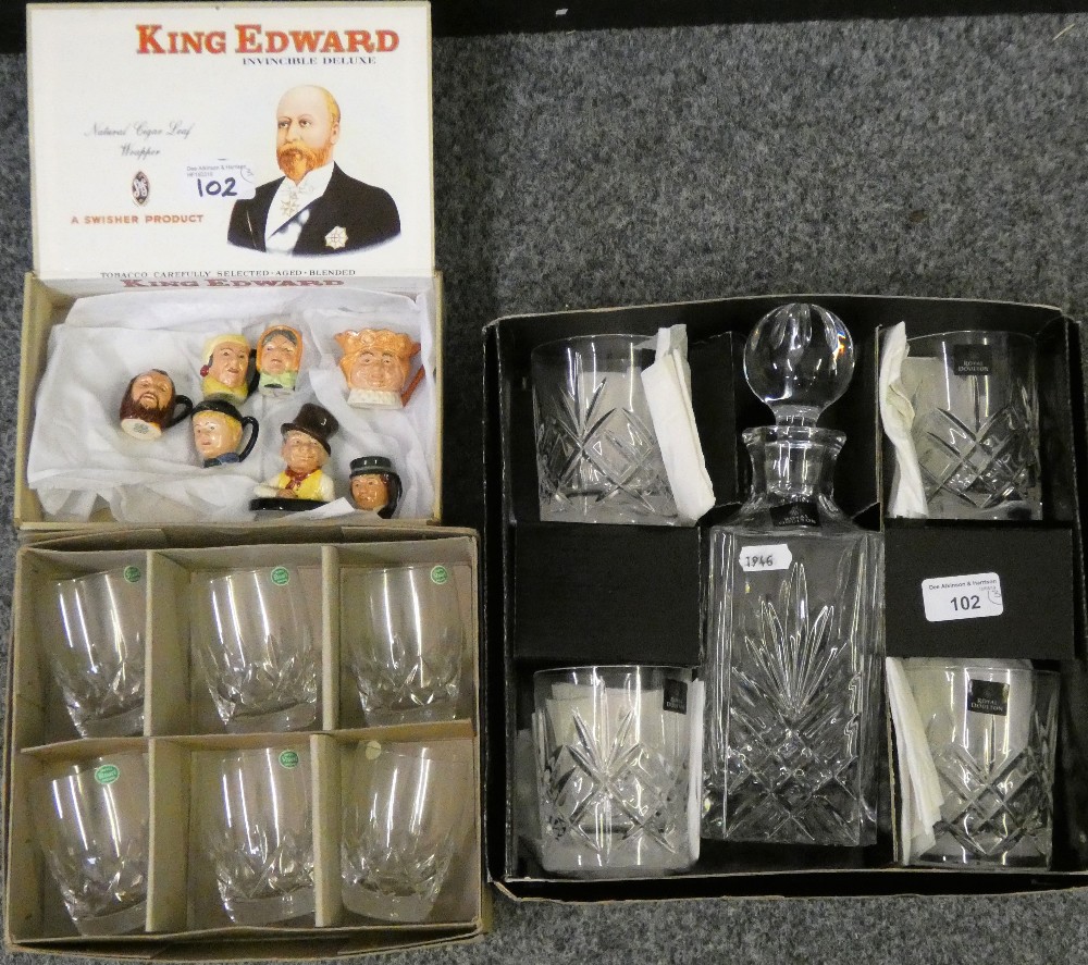 A cased Royal Doulton decanter with four whiskey tumblers together with a set of six Stuart