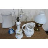 A large white ceramic jardinière on stand together with matching jug, oil lamp, two table lamps