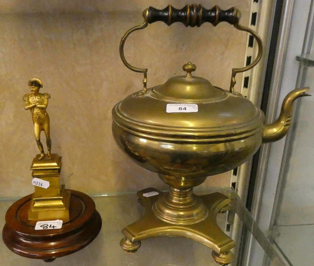 A brass kettle on stand together with brass figure of Napoleon on wooden plinth (2)
