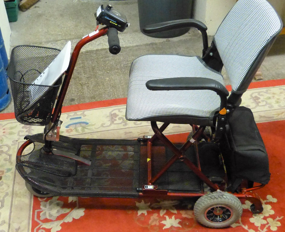 A lightweight collapsible, four wheel mobility scooter with charger
