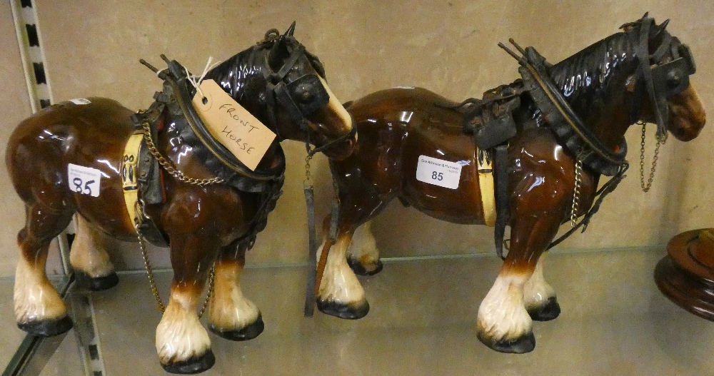 Model of two wheeled carts together with two ceramic cart horses