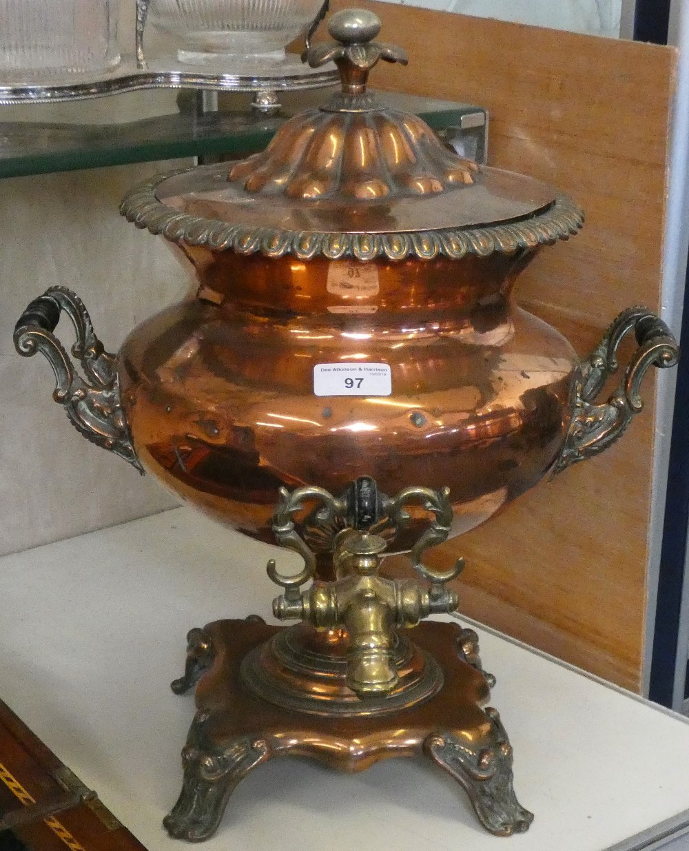 Bell, Nottingham - a 19th century copper samovar with twin handles and tap standing on a scroll