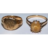 A 9ct gold signet ring and a 9ct gold dress ring (2) 10 gms