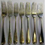 A set of four Victorian silver 'Old English' pattern dessert forks Exeter 1838 and three Georgian