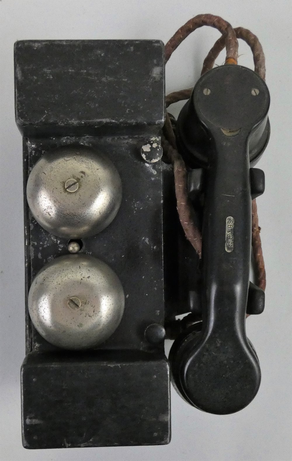 A 20th century 'Plessey Co. Ltd' field telephone set, model No. F MK1, in a blackened cast metal - Image 2 of 4