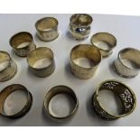 A collection of eleven silver napkin rings including London 1924 with pierced decoration