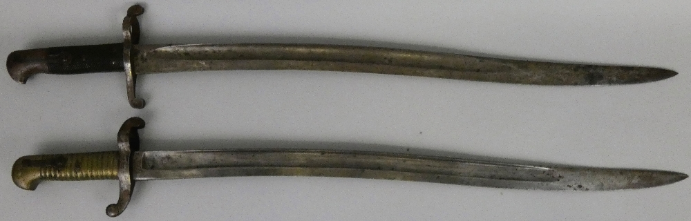 An 1853 pattern British artillery sword bayonet, together with an 1856 pattern British sword bayonet