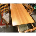 A pine table with a set of four ladder back dining chairs and a none matching carver chair (6)