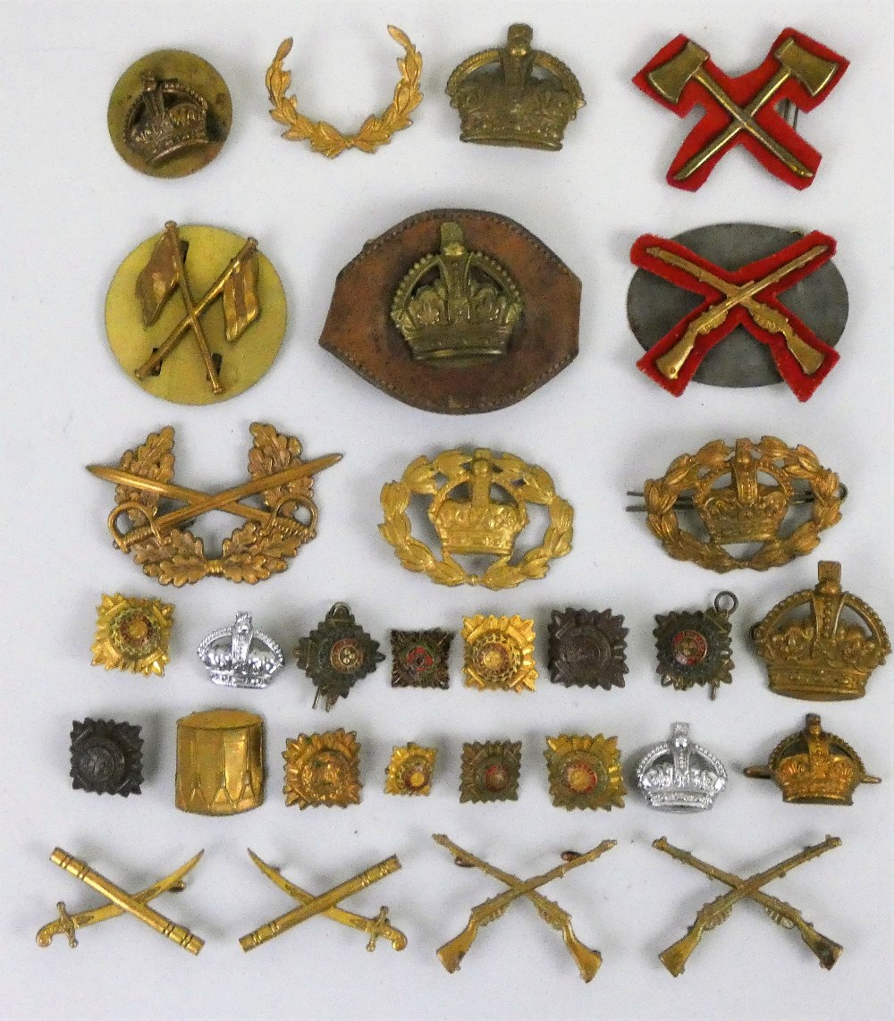 A collection of approximately 70 assorted Kings Crown and rank badges.