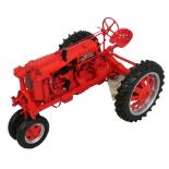 A 1:16 scale ERTL Farmall model 'F-20' narrow front tractor, together with a 'Farmall Farming'