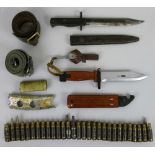 A Soviet MKM bayonet in scabbard, together with an unmarked bayonet, two military belts and a