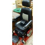 A powered wheelchair from Beechwood mobility together with charger, in good working order