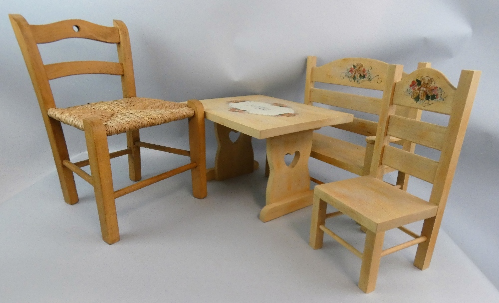 A selection of dolls furniture, to include a handpainted bench, table and single chair, with teddy