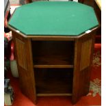 An oak octagonal table with reversible top to convert to games table