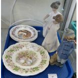 Three Nao figures together with five Royal Doulton Brambly hedge plates