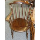 A mahogany stick back elbow chair