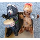 A clockwork bear playing a drum together with a monkey playing cymbals (2)